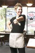 Smiling waitress showing how restaurants needs to be safe.