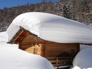 Small building in desperate need of snow removal. 