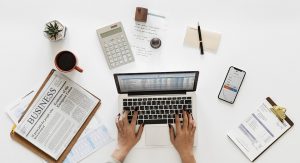 Picture of a persons desk while working at an accounting firm.