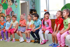 Children waiting for lunch at a daycare center. 